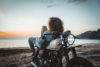 Woman reclining on motorcycle