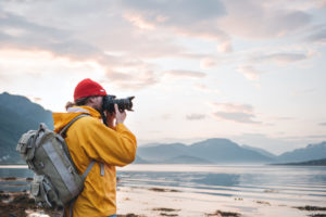 Man taking photography in Nordic landscape