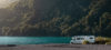 Recreational Vehicle (RV) parked at lake