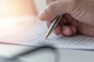 Person filling out a form