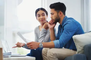 Man and Woman with a computer and paperwork