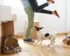 Man picking woman up with dog